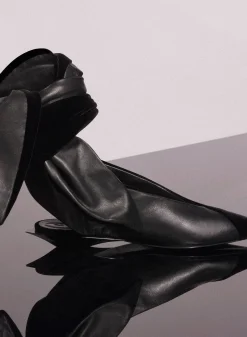 MUGLER black leather knot fang flat mules