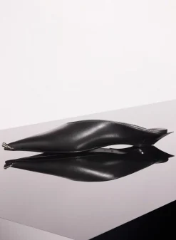 MUGLER black leather piercing fang flat mules