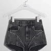 Women MUGLER washed black denim studded shorts